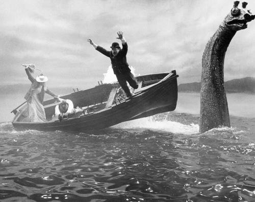 A $25,000 mechanical Loch Ness monster sends actors tumbling in the water in
this scene for United Artists' thriller "The Private Life of Sherlock Holmes"
which was being filmed in Scotland, Oct. 1969. Dr. Watson (Colin Blakely) leaps
out of boat at right, while Gabrielle (Genevieve Page) and Sherlock Holmes
(Robert Stephens) are struggling to keep their balance. The mechanical monster
has disappeared into the 754-foot-deep loch and a San Francisco Insurance
company says it is prepared to pay off. A fireman's fund spokesman says the
monster itself isn't covered by insurance, but production delay costs because of...
